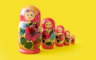 Matryoshka doll set in a row isolated. A symbol of the feminine side of Russian traditional and culture. Wooden doll toys. Crafts, painting and art.