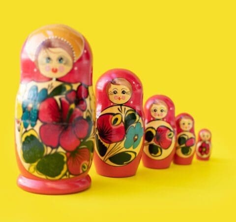Matryoshka doll set in a row isolated. A symbol of the feminine side of Russian traditional and culture. Wooden doll toys. Crafts, painting and art.