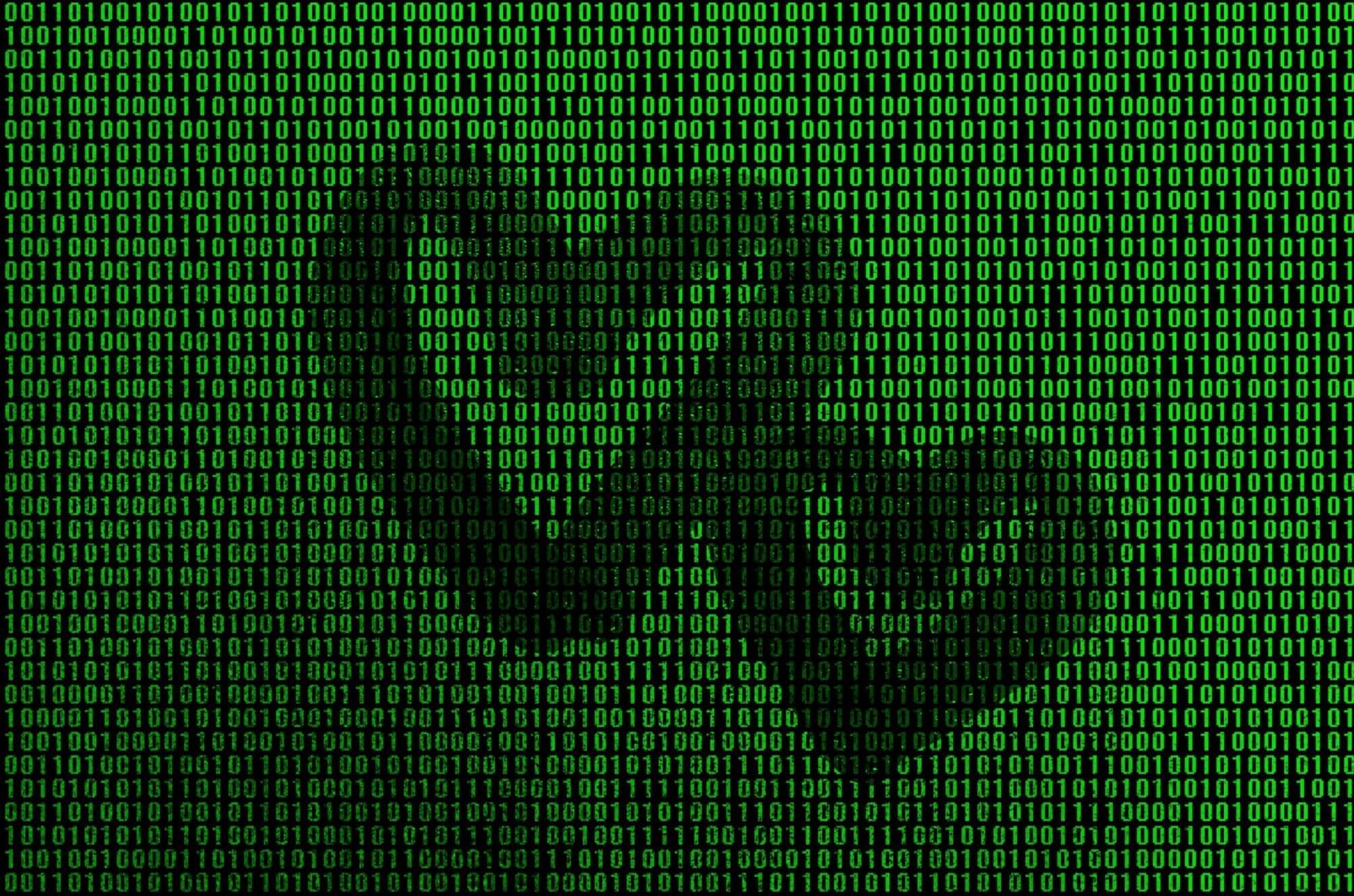 Binary code from bright green figures, through which the shape of the heart is visible